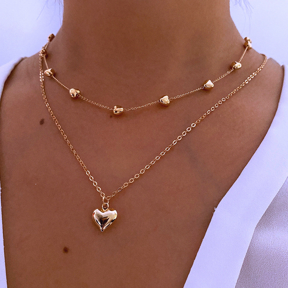 Collier Double Rang avec Pendentif Cœur – Élégance et Féminité